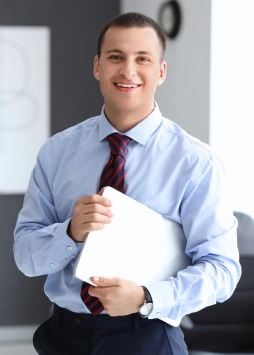 Professional man representing the Accounting Assistant position at T. Williams & Associates
